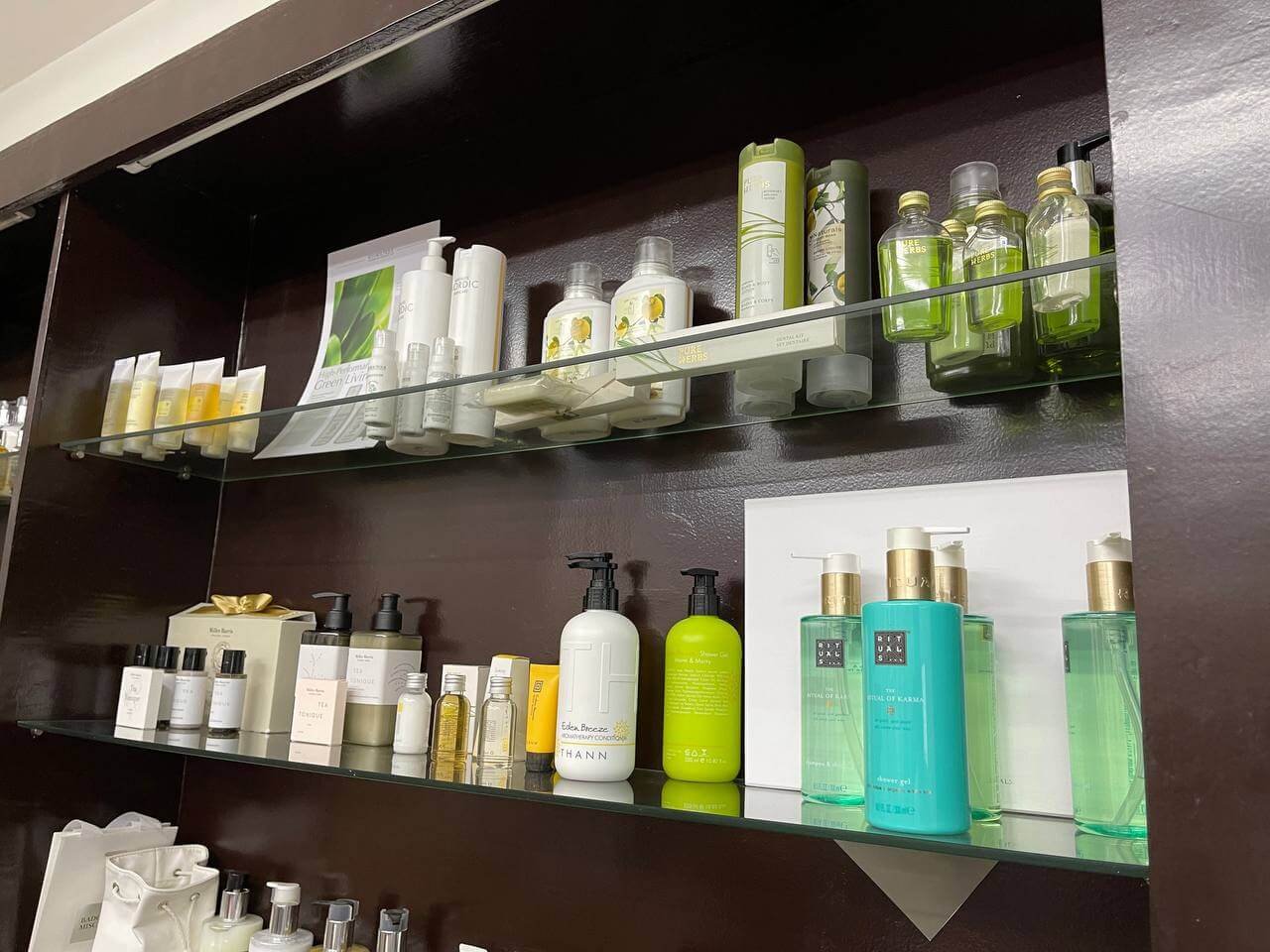 Eastworld showroom shelves with hotel bath amenities and dispensers