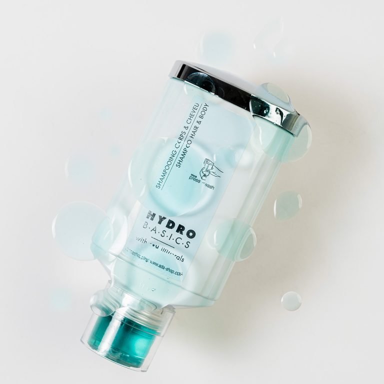 Hydro Basics amenity bottle with a silver cap and water bubbles