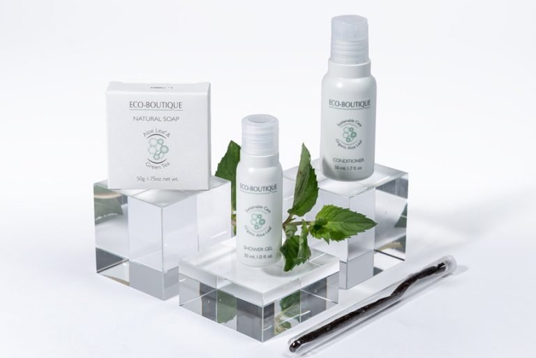 Eco-Boutique soap box and two amenity bottles on clear acrylic blocks