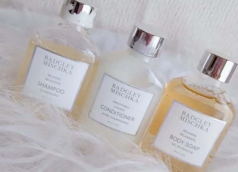 Badgley Mischka shampoo, conditioner and body soap bottles on white fur