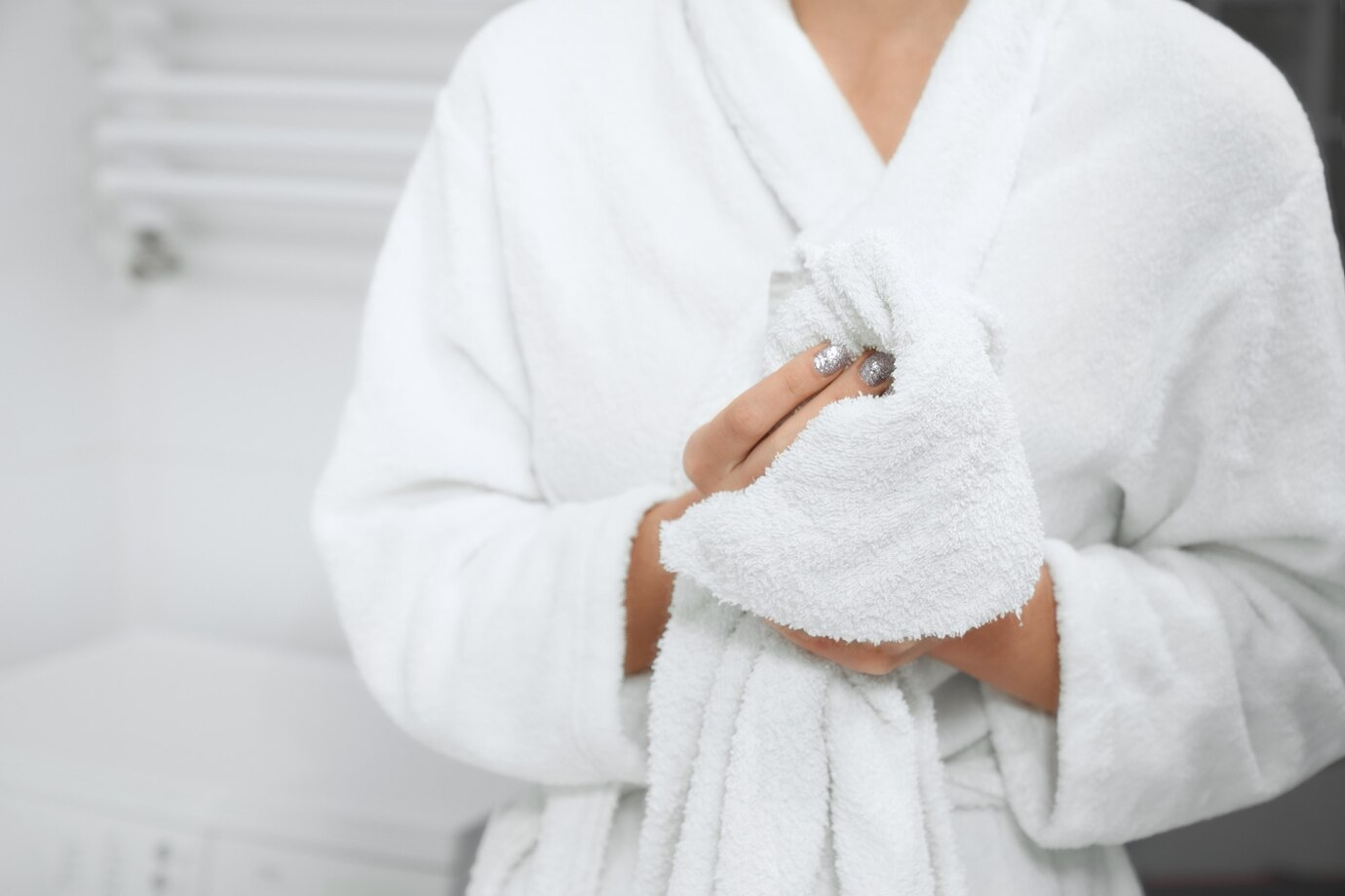 Guest in a white hotel bathrobe