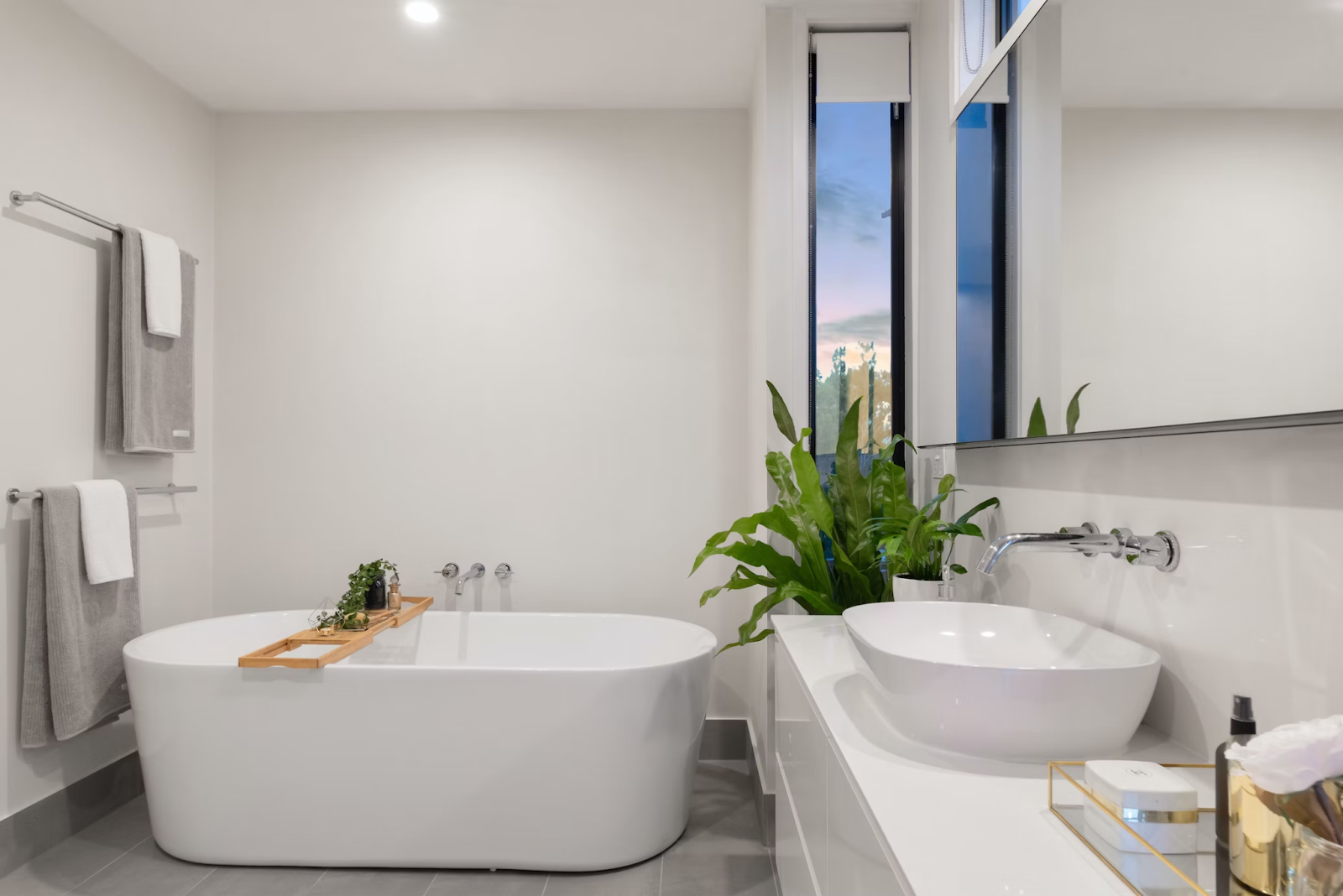 Modern hotel bathroom with a freestanding tub