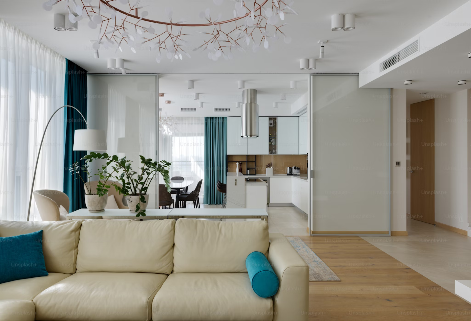 Bright hotel suite living area with a sofa