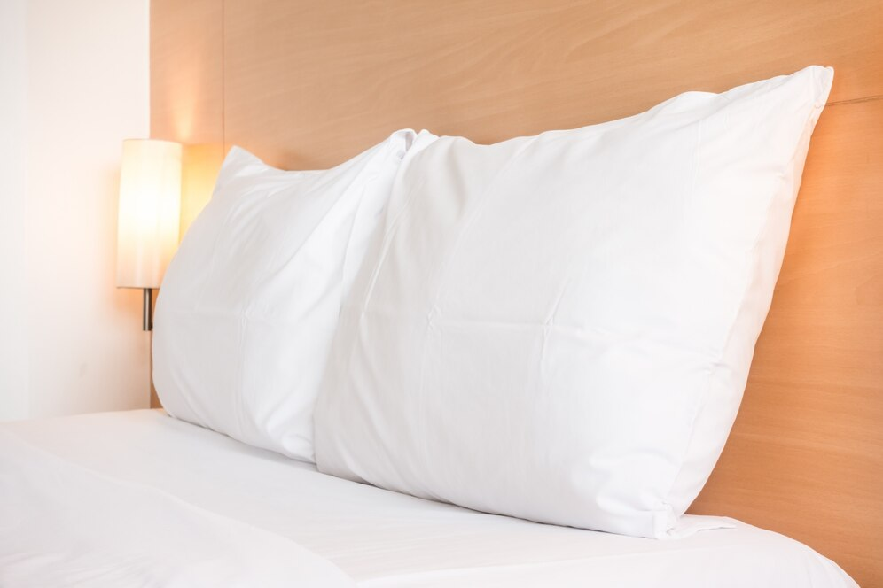 White pillow on a hotel bed